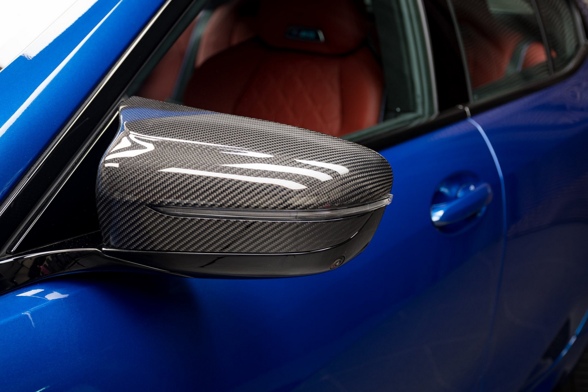Blue BMW with carbon-fiber side mirror